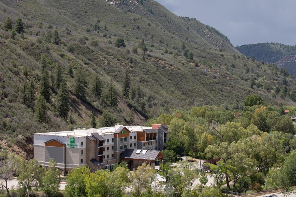 a building in the middle of a mountain at Holiday Inn & Suites Durango Downtown by IHG in Durango
