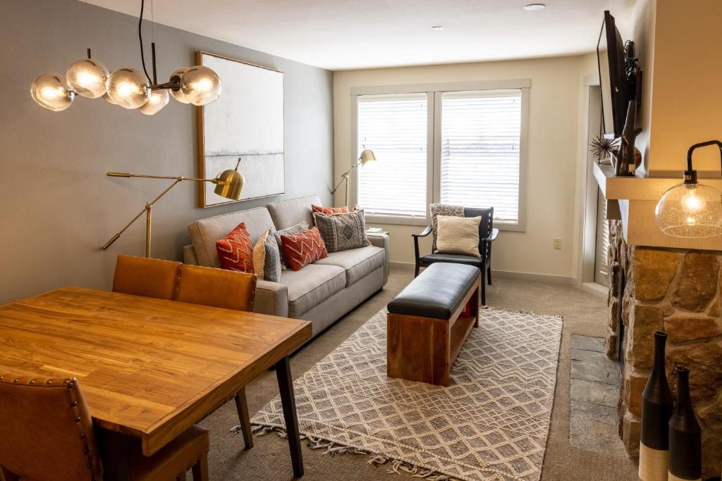 a living room with a couch and a table at 2204 - Two Bedroom Deluxe Eagle Springs East condo in Solitude