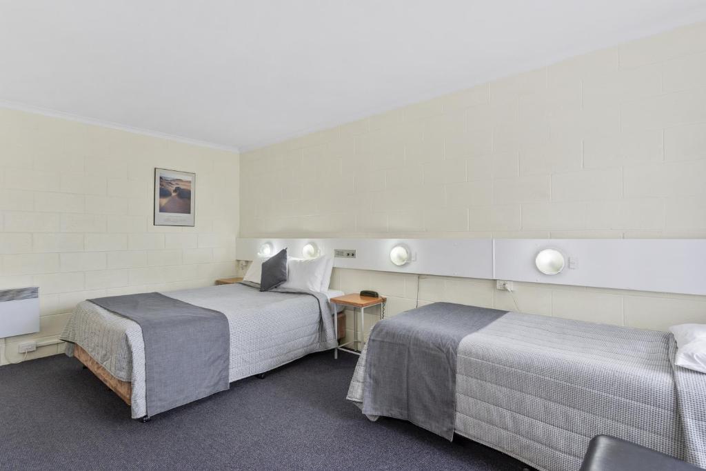 Postel nebo postele na pokoji v ubytování Martin Cash Motel