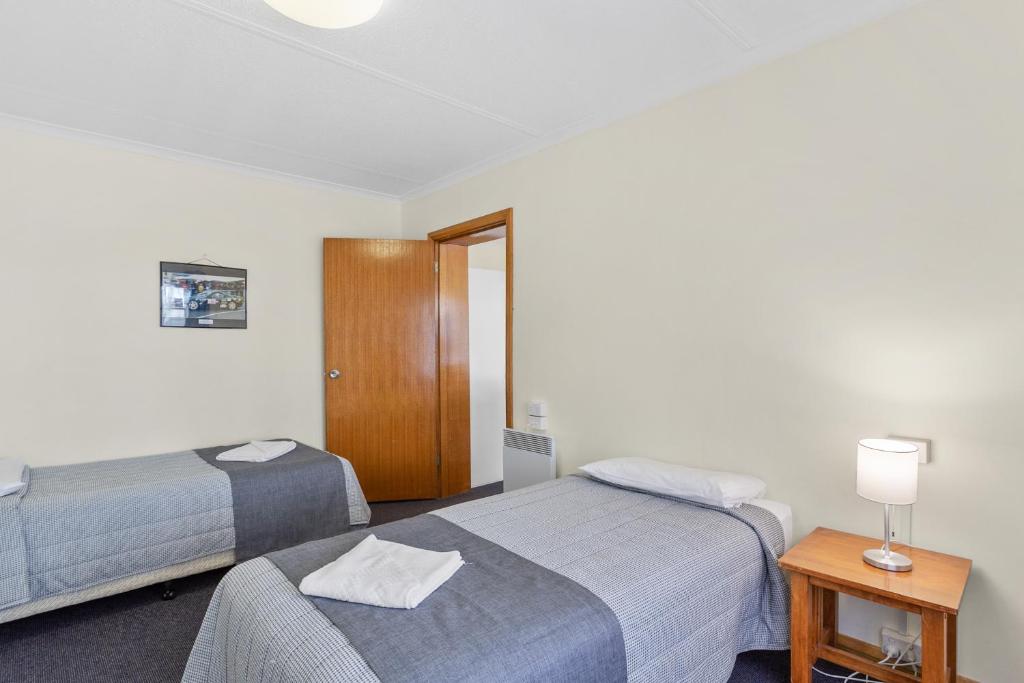 Postel nebo postele na pokoji v ubytování Martin Cash Motel