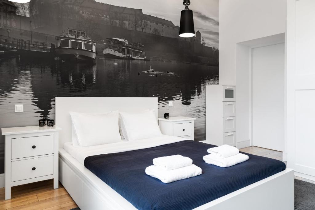 Posteľ alebo postele v izbe v ubytovaní Househost Apartment: Bonerowska 5/19