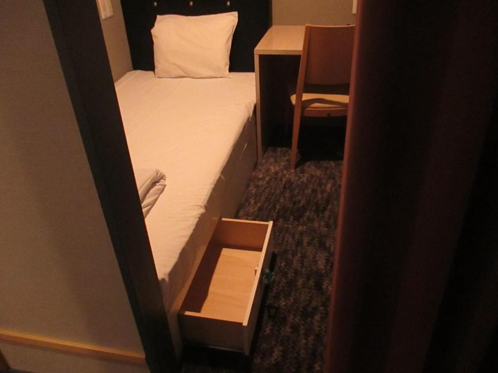 Postel nebo postele na pokoji v ubytování Hotel M Matsumoto