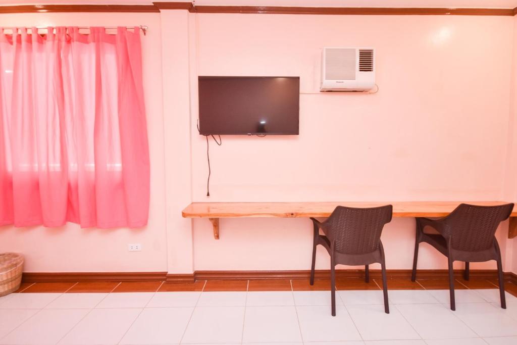 TV a/nebo společenská místnost v ubytování Nigi Nigi Too Beach Resort