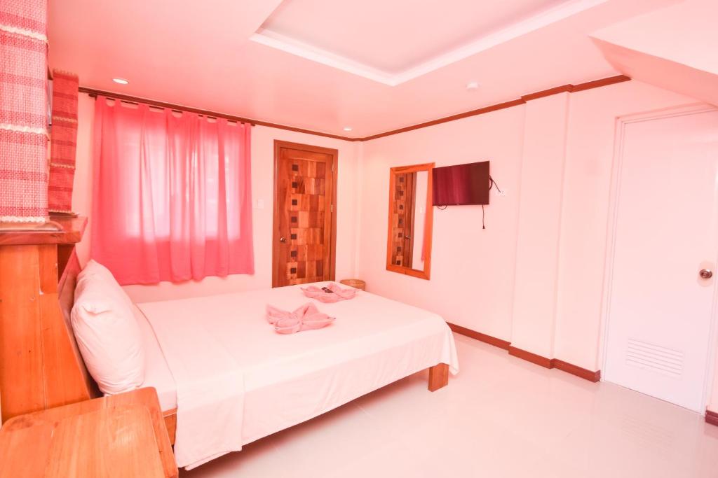 Postel nebo postele na pokoji v ubytování Nigi Nigi Too Beach Resort
