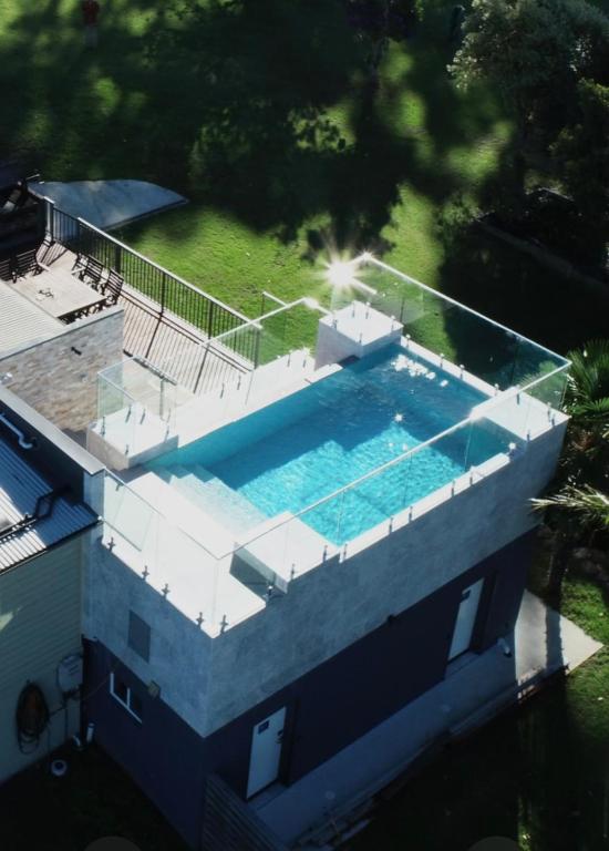 an overhead view of a swimming pool on a house at Sinclairs Country Retreat - Welcoming Guests 18 years and older in Conjola