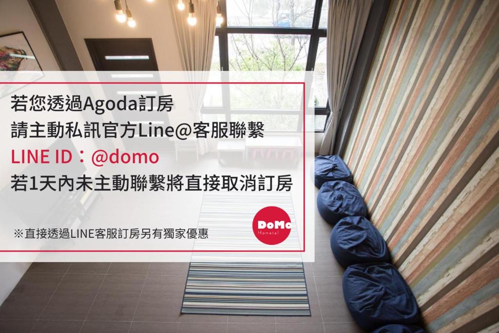 a sign in a room with a sign in a room at DoMo Yilan in Yuanshan