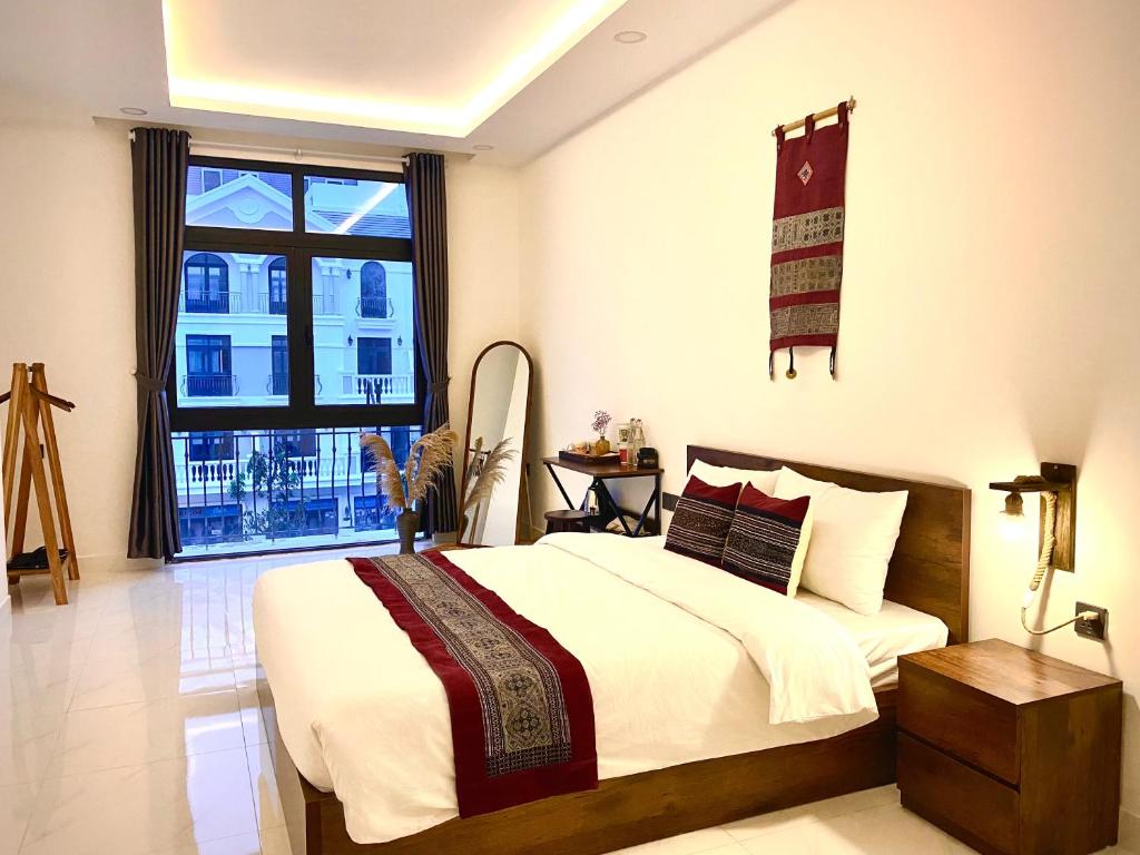 Giường trong phòng chung tại Herbs Spa & Hotel Grand World Phu Quoc