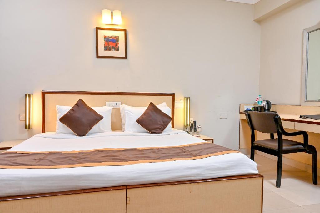 Postel nebo postele na pokoji v ubytování Regenta Inn Palacio De Goa, Panjim