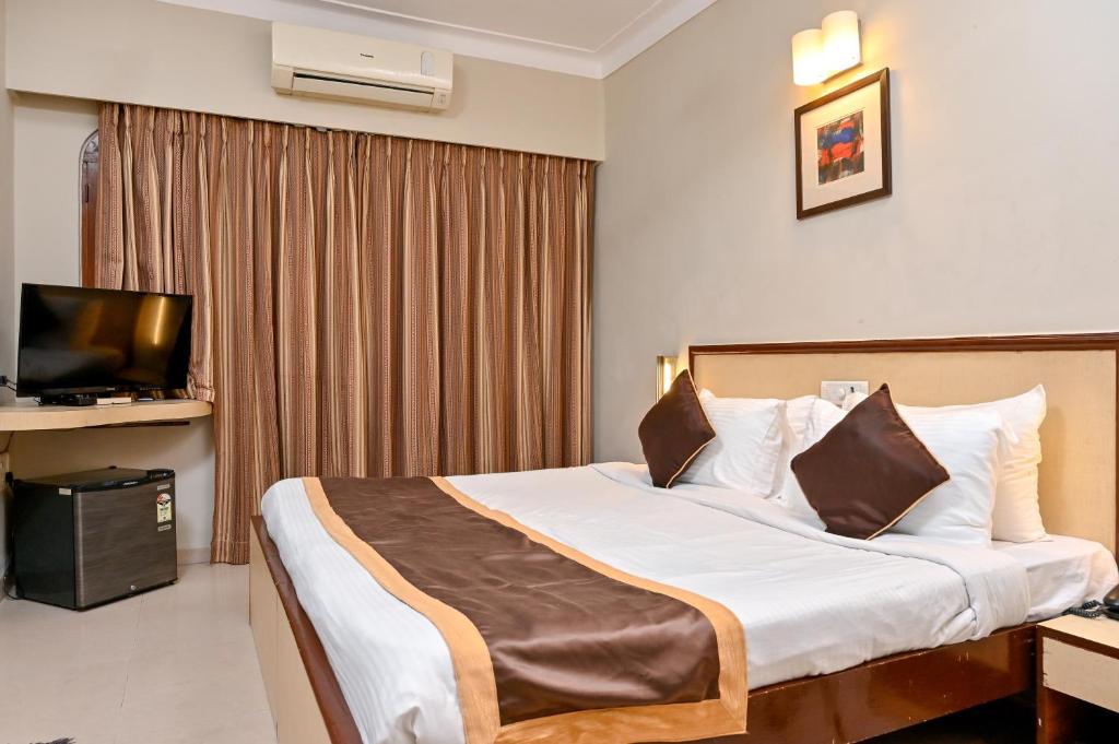 Postel nebo postele na pokoji v ubytování Regenta Inn Palacio De Goa, Panjim