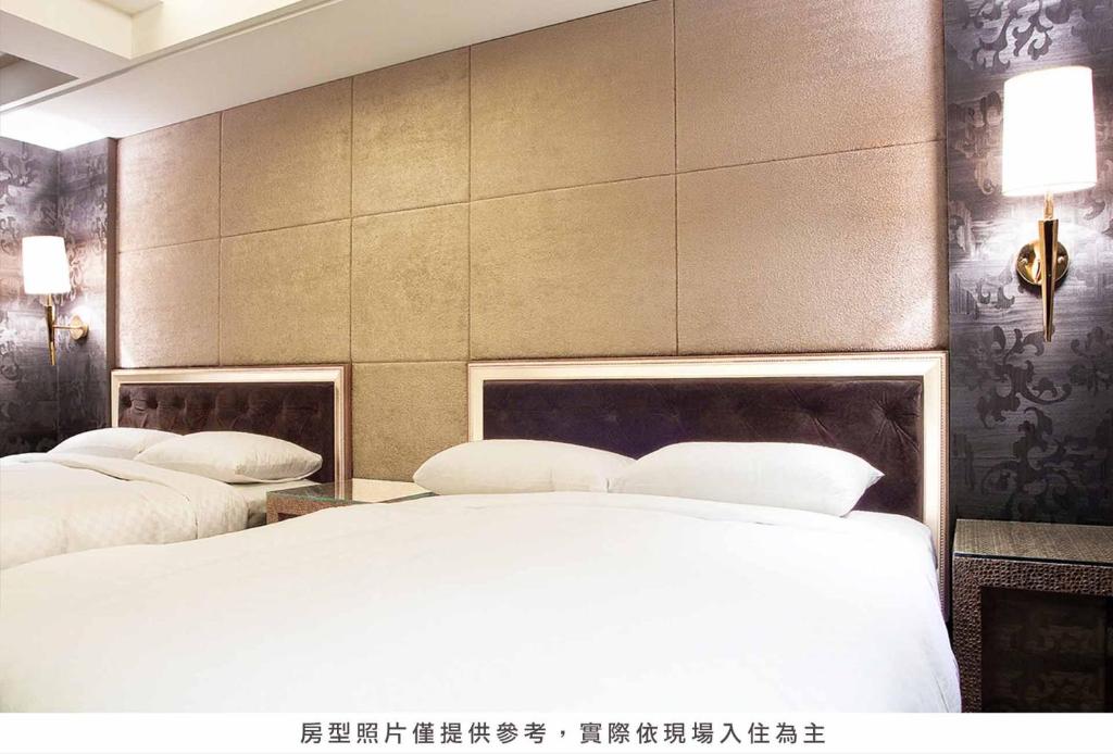 Postel nebo postele na pokoji v ubytování Royal Group Hotel Chun Shan Branch