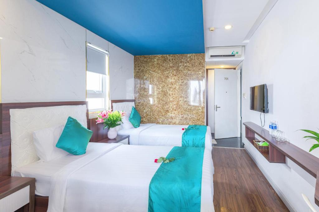 Postel nebo postele na pokoji v ubytování Rich Hotel