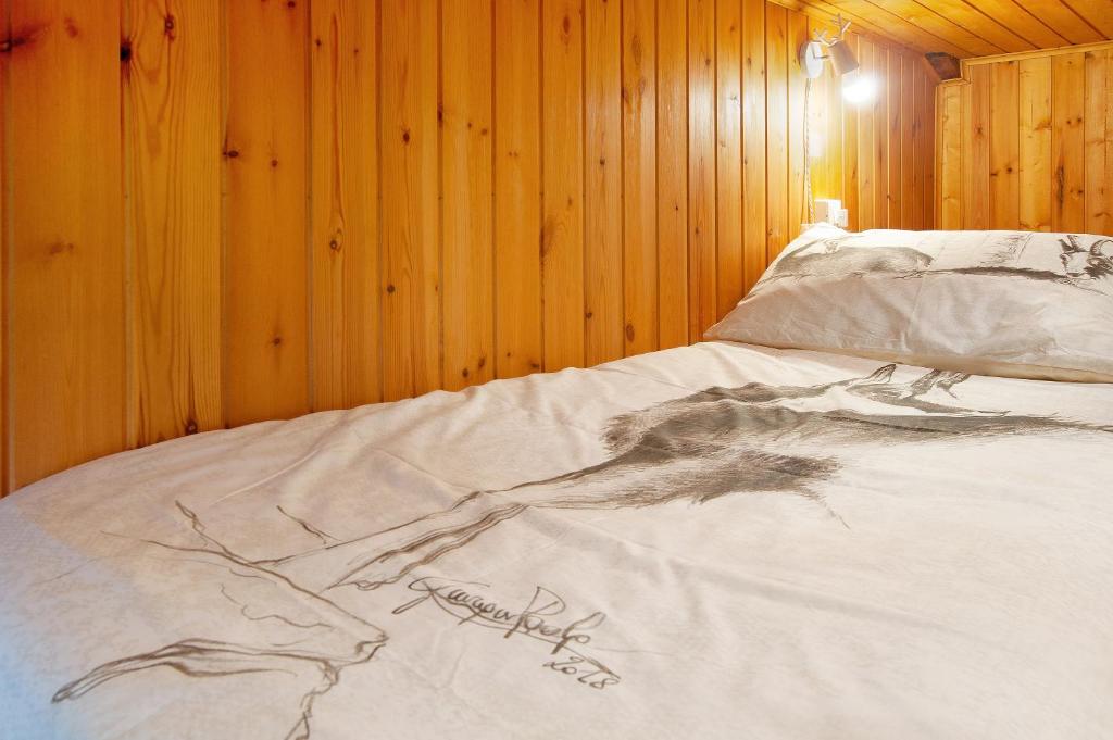 Łóżko lub łóżka w pokoju w obiekcie Sweet Somma Mountain Lodge 2