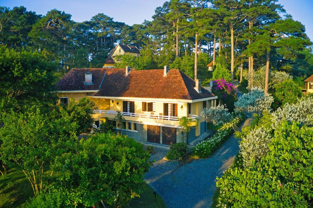 an aerial view of a house in the woods at Ana Mandara Villas Dalat Resort & Spa in Da Lat