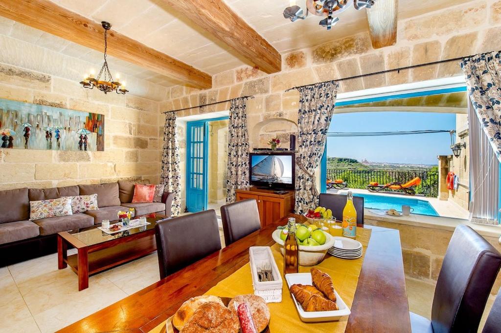 TV a/nebo společenská místnost v ubytování Ta Rena Holiday Home