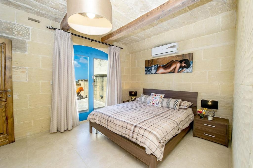 Postel nebo postele na pokoji v ubytování Ta Rena Holiday Home