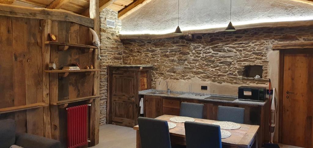 Kuchyň nebo kuchyňský kout v ubytování Casa Vacanza I Foresti Ex Scuola
