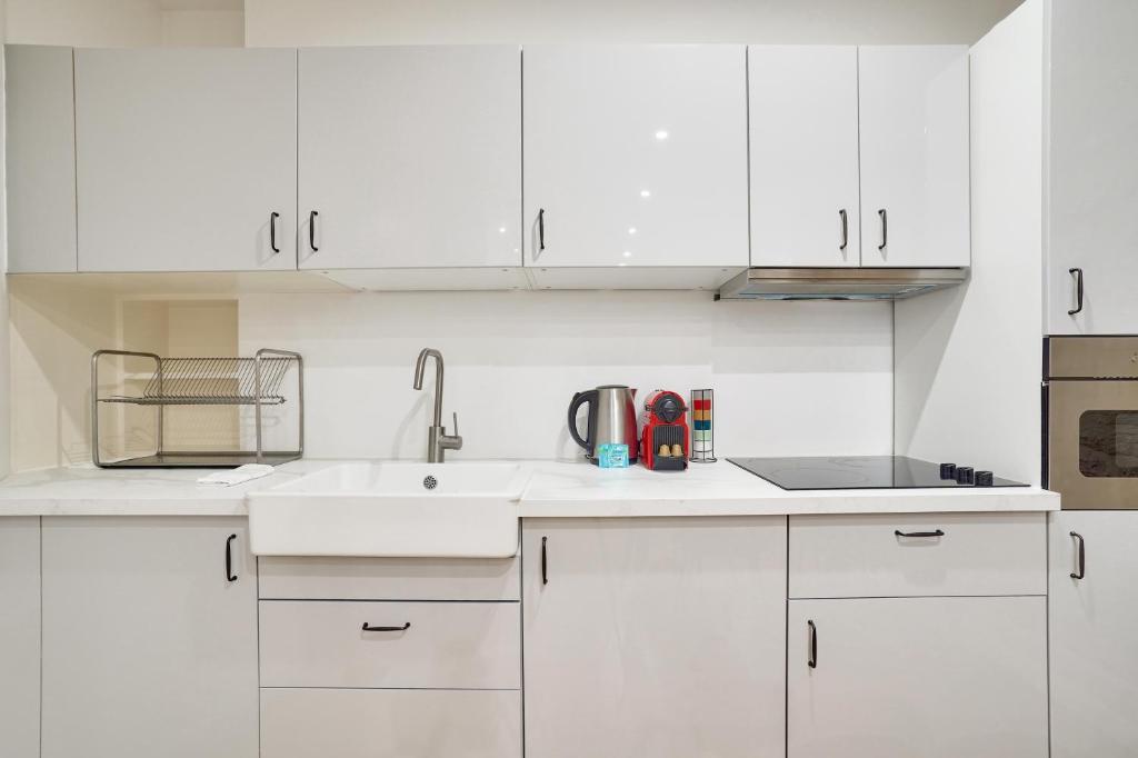 Kuchyňa alebo kuchynka v ubytovaní Appartement neuf - proche Tour Eiffel