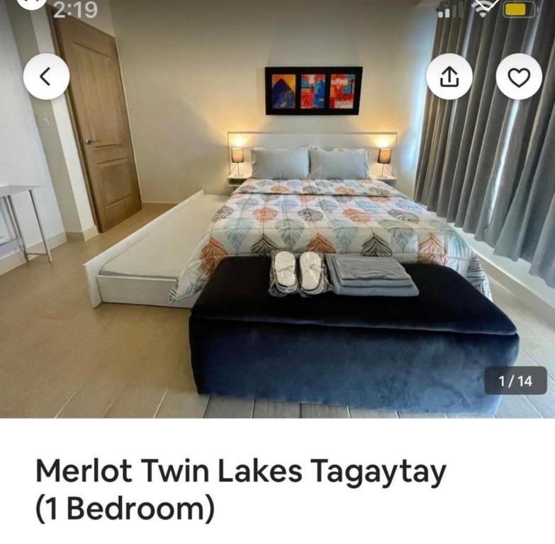 a bedroom with a king sized bed with a platform at Twin lakes Merlot LL3-F in Tagaytay