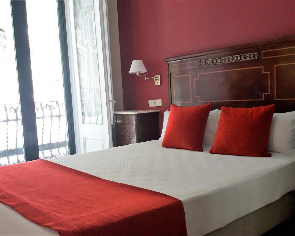 Postel nebo postele na pokoji v ubytování Hotel Noucentista