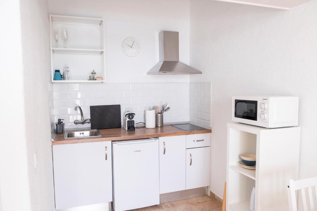 Kuchyň nebo kuchyňský kout v ubytování Wohnung Buganvilla