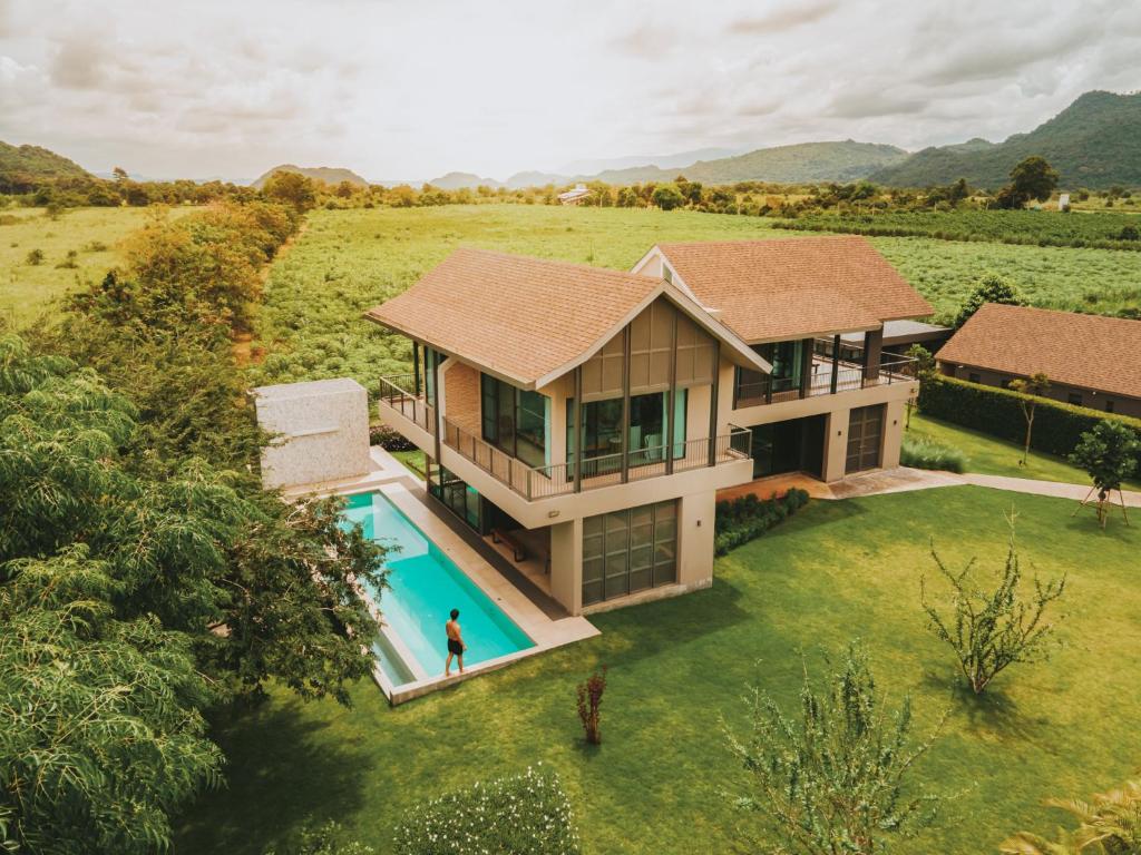an aerial view of a house with a swimming pool at twoDO KhaoYai in Mu Si