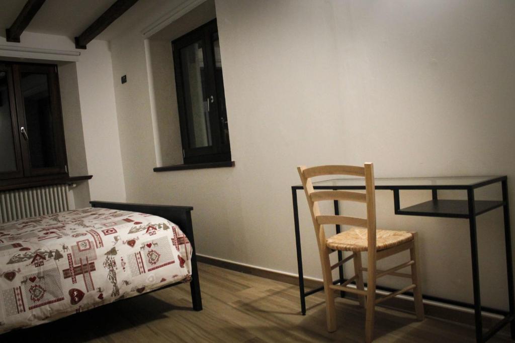 Postel nebo postele na pokoji v ubytování La Casa dei Gatti