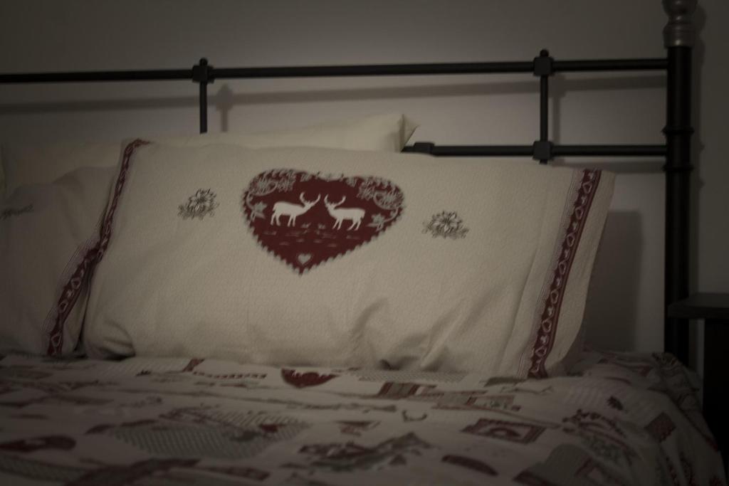 Postel nebo postele na pokoji v ubytování La Casa dei Gatti
