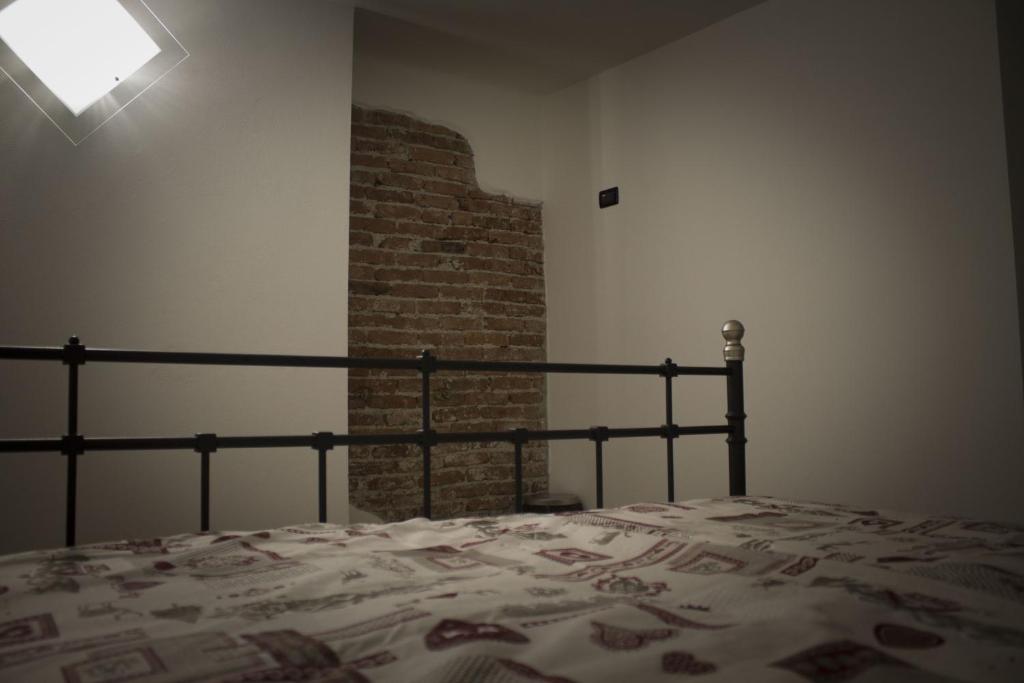 Postel nebo postele na pokoji v ubytování La Casa dei Gatti