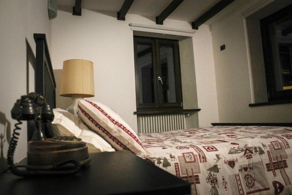 Postel nebo postele na pokoji v ubytování La Casa dei Gatti