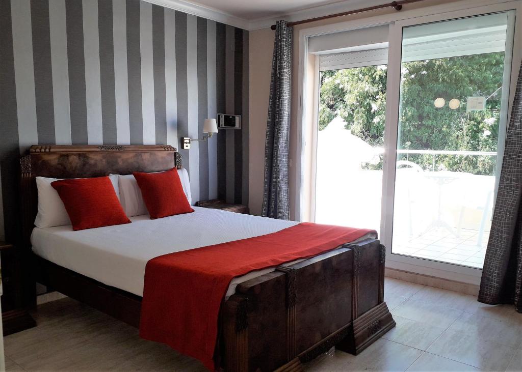 Postel nebo postele na pokoji v ubytování Hotel Noucentista