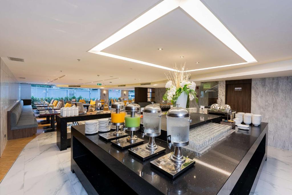 A polished dining area with a central drinks and buffet station.