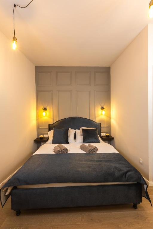 Postel nebo postele na pokoji v ubytování Apáca 30 Apartman **** Győr
