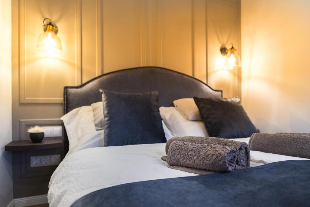Postel nebo postele na pokoji v ubytování Apáca 30 Apartman **** Győr