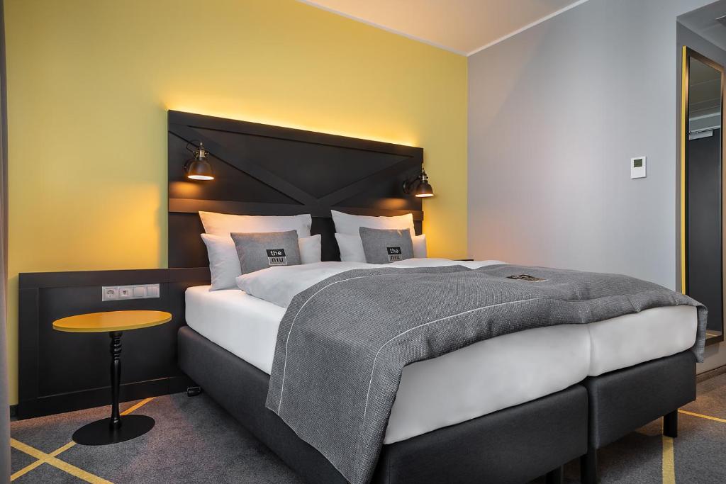 Postel nebo postele na pokoji v ubytování Holiday Inn - the niu, Fury Aschheim Messe by IHG