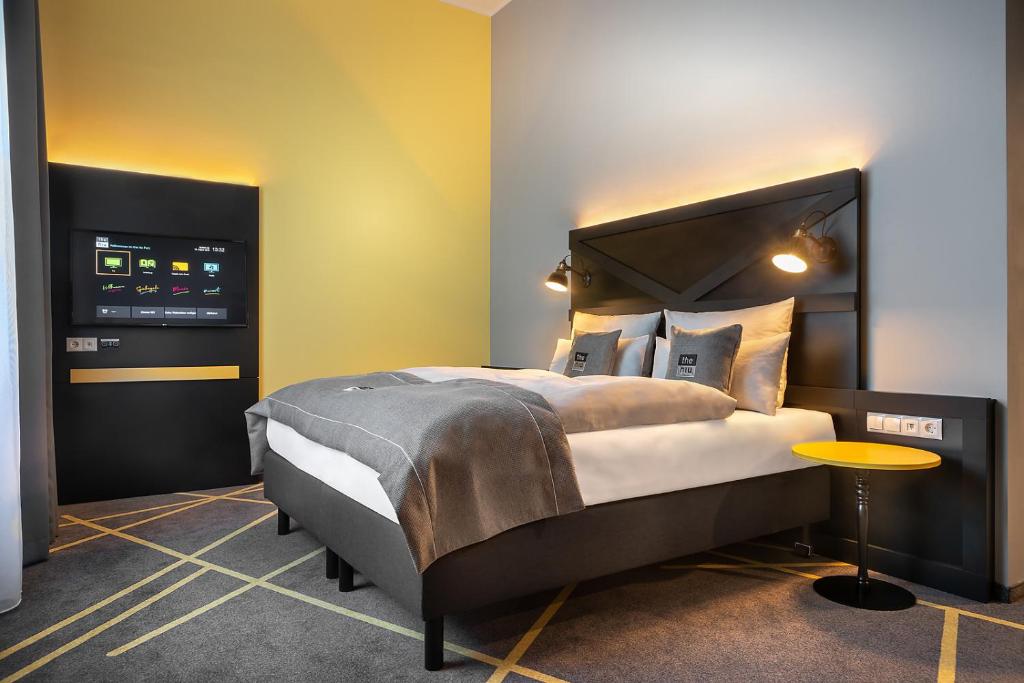 Postel nebo postele na pokoji v ubytování Holiday Inn - the niu, Fury Aschheim Messe by IHG