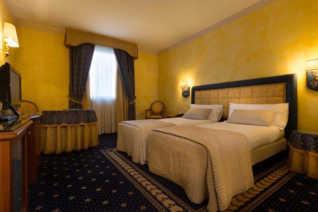 Postel nebo postele na pokoji v ubytování Hotel Motel Del Duca