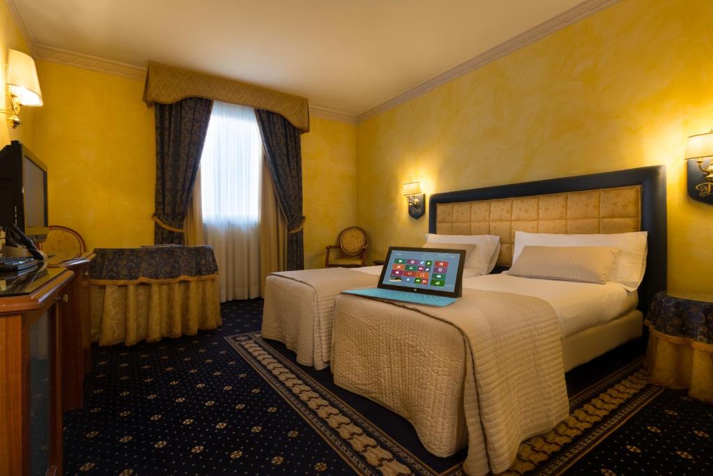 Postel nebo postele na pokoji v ubytování Hotel Motel Del Duca