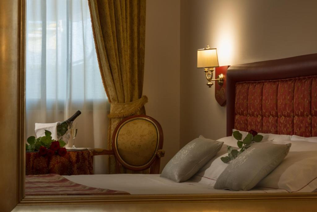 Postel nebo postele na pokoji v ubytování Hotel Motel Del Duca