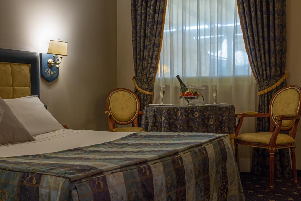Postel nebo postele na pokoji v ubytování Hotel Motel Del Duca