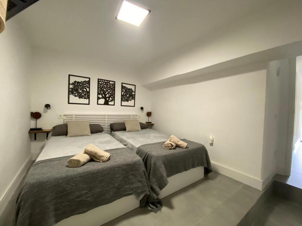 Posteľ alebo postele v izbe v ubytovaní DUPLEX TORREMOLINOS 2 DORM / 2 WC