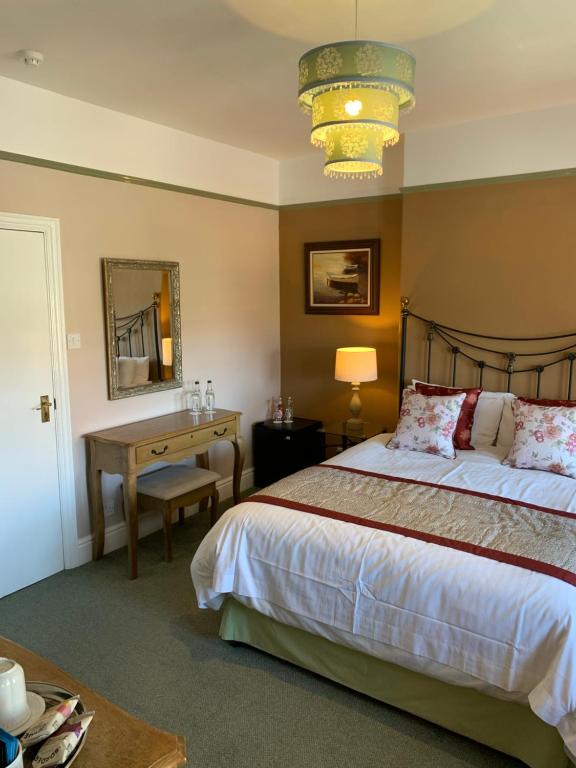Postel nebo postele na pokoji v ubytování Glendower House