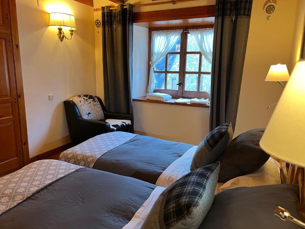 Posteľ alebo postele v izbe v ubytovaní Casa de piedra con encanto en el bonito pueblo de Bagergue