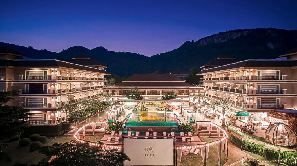 a hotel with a pool in the middle of a courtyard at Lacol Khao Yai - A Chatrium Collection in Mu Si