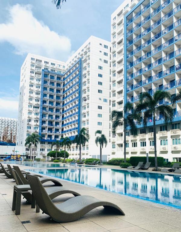 a row of chairs in front of a large building at Sea Residences - Property Val Alano 0995-448-8872 in Manila