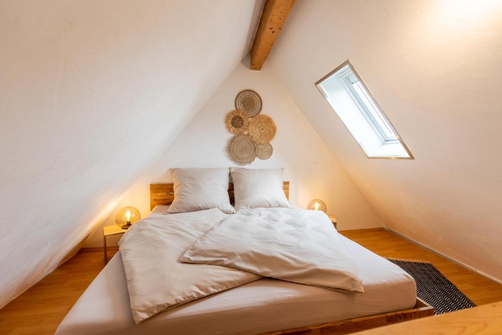 a bedroom with a bed in the attic at Pfälzer Nest in Pleisweiler-Oberhofen