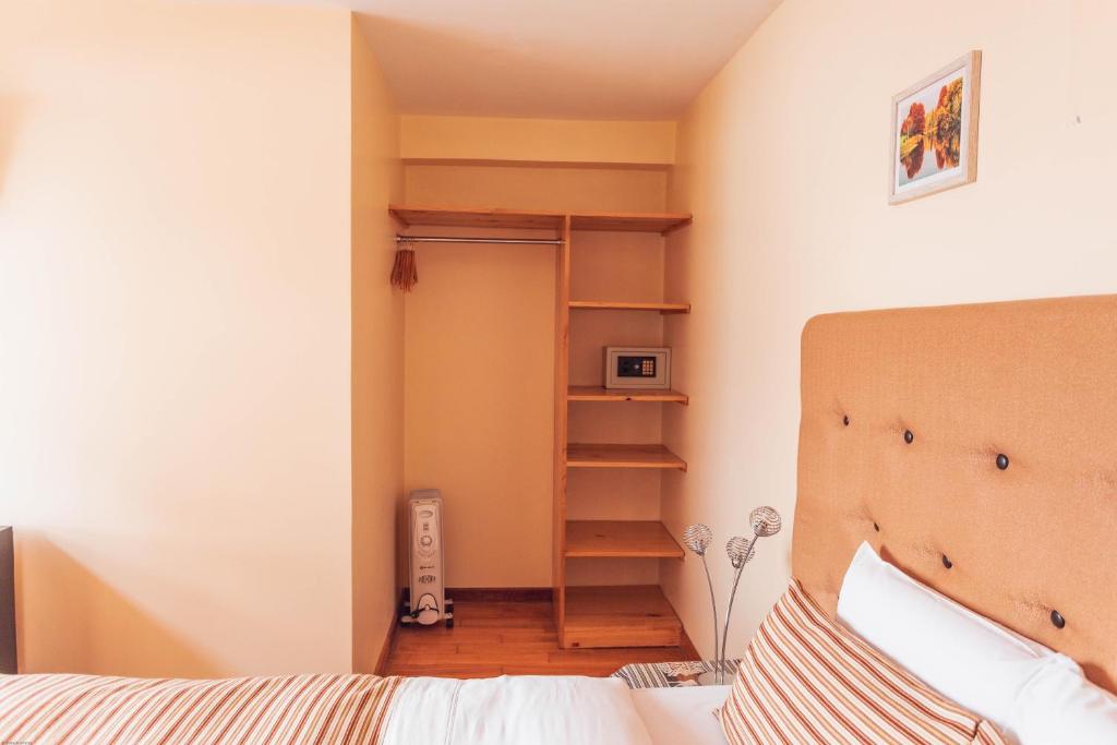 Postel nebo postele na pokoji v ubytování Hotel Las Quenas