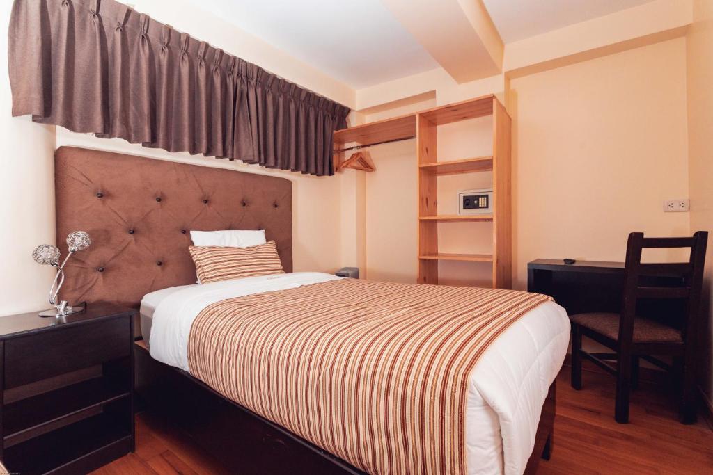 Postel nebo postele na pokoji v ubytování Hotel Las Quenas