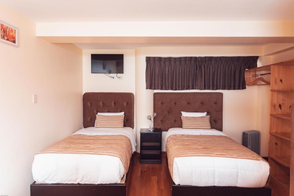 Postel nebo postele na pokoji v ubytování Hotel Las Quenas