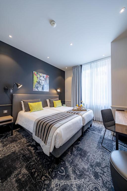 Postel nebo postele na pokoji v ubytování Allobroges Park Hôtel