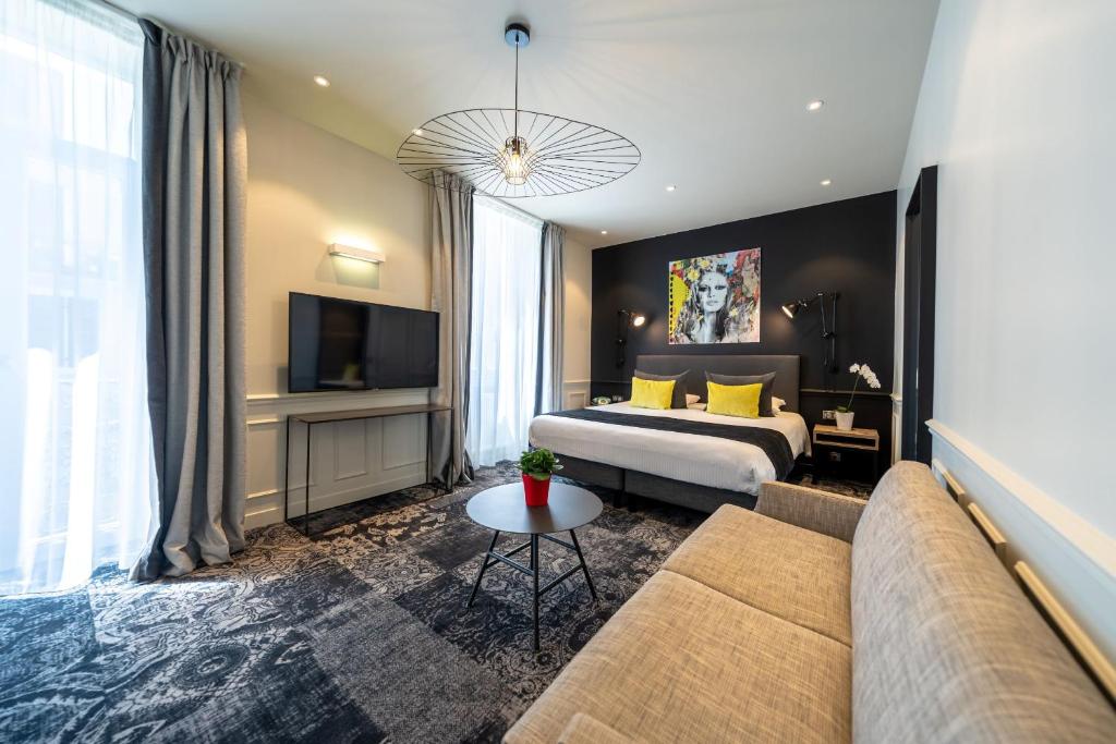 TV a/nebo společenská místnost v ubytování Allobroges Park Hôtel